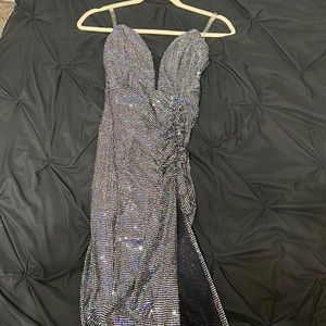 Fitted Black sequins dress with slit.In the video you’ll see the straps are gone